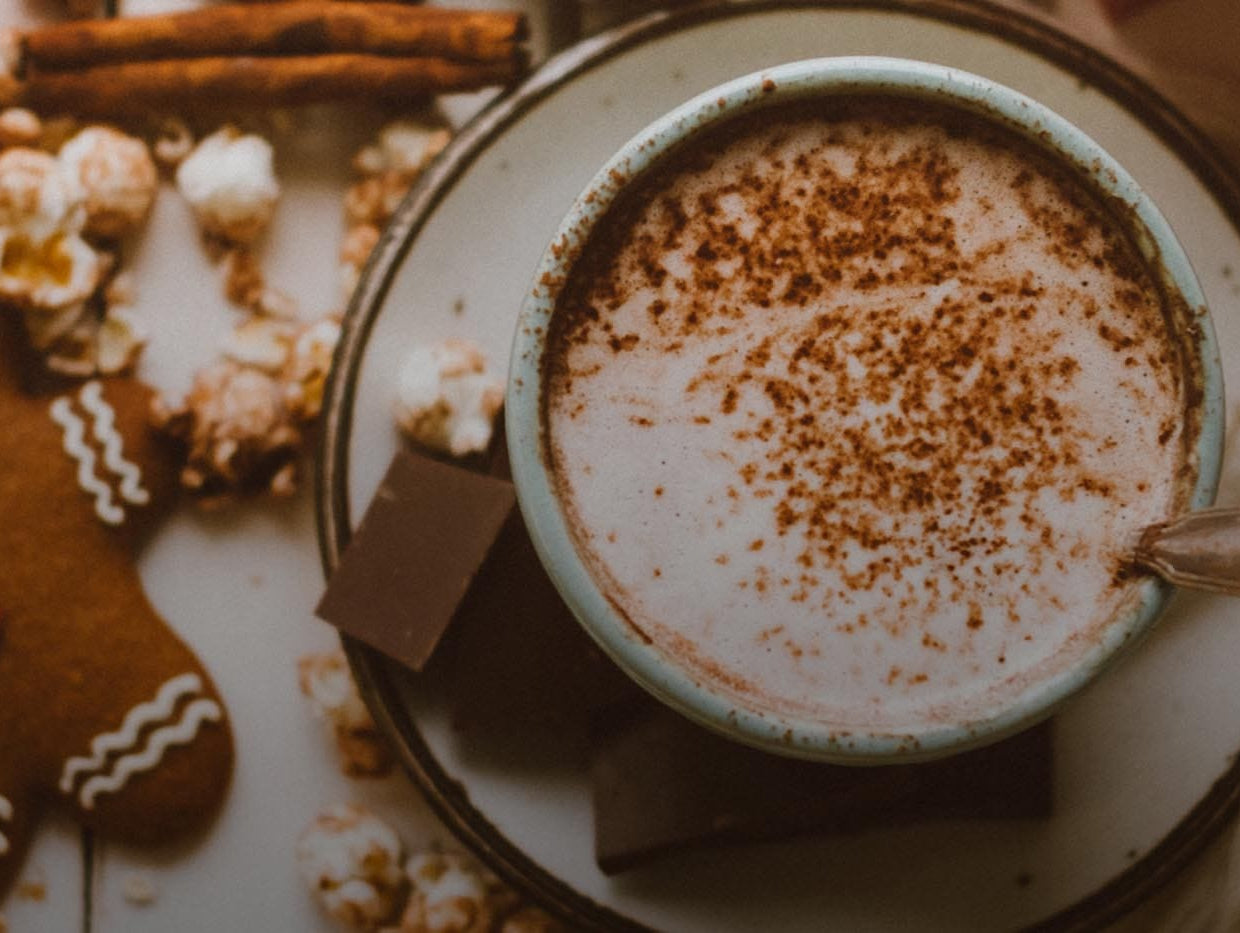 Cup of coffee and a gingerbread cookie