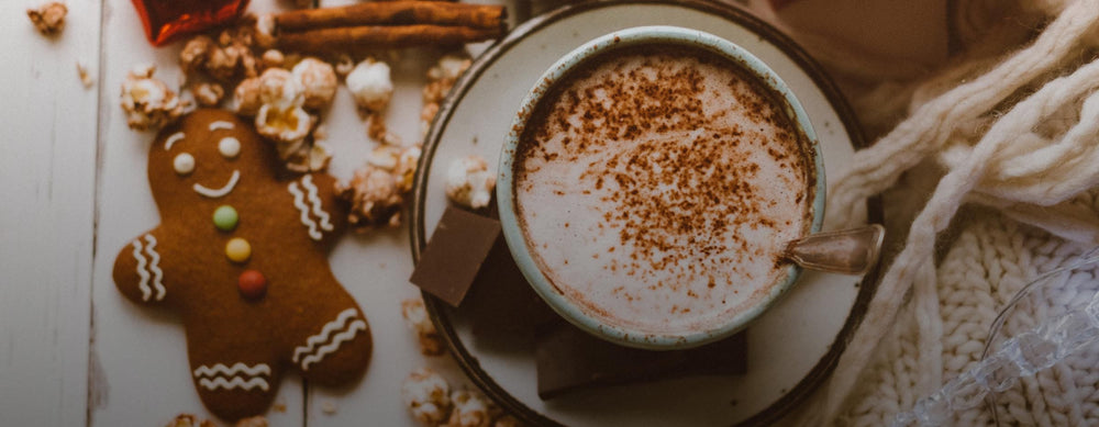Cup of coffee and a gingerbread cookie