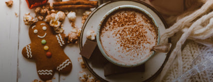 Cup of coffee and a gingerbread cookie