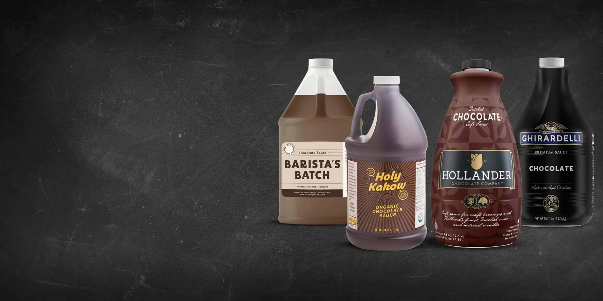 Four bottles of chocolate-flavored products on a dark background